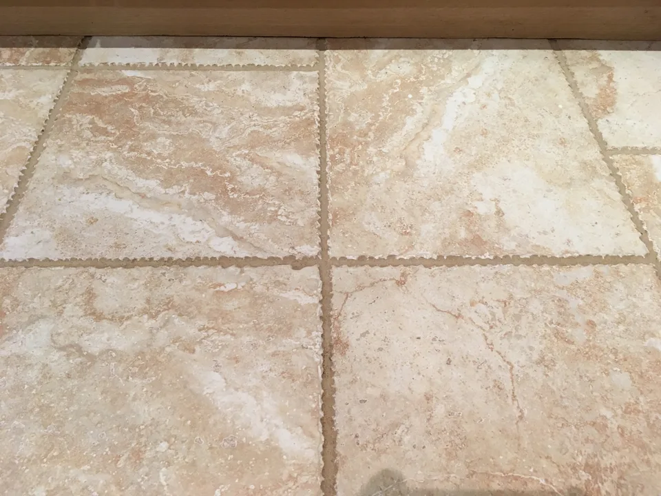 Ceramic tiled floor after professional cleaning, with lighter grout lines